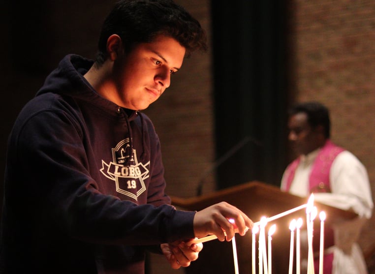 boy lighting candles