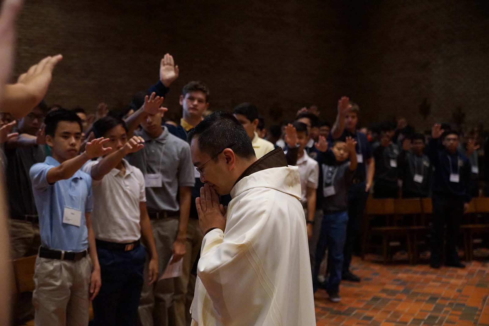 Father Zoy leading service